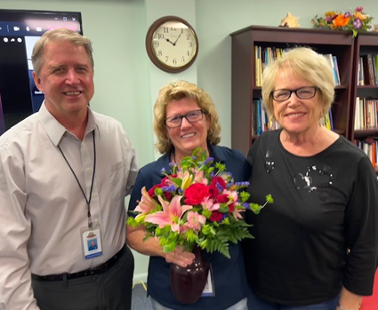 Executive Director of Operations and Planning Pat Lefere and Superintendent Theresa Axford recognize Patricia Nicholas as the District Support Related Employee of the Year.
