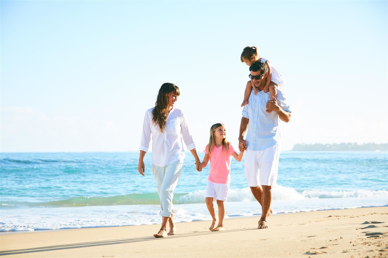 Family walking on the beach
