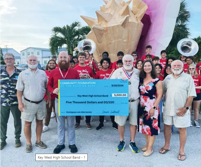 Society members with band and check